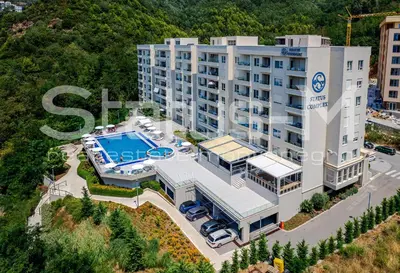 an aerial view of a building with a swimming pool at Status-M Apartments 135 in Becici