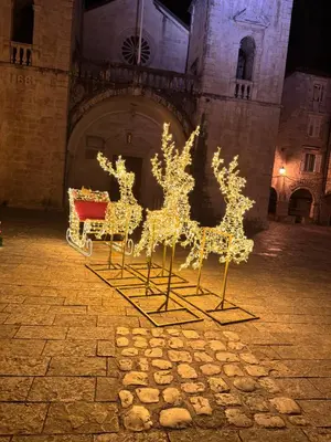 a display of christmas lights in a courtyard at Little Bay Apartments in Kotor