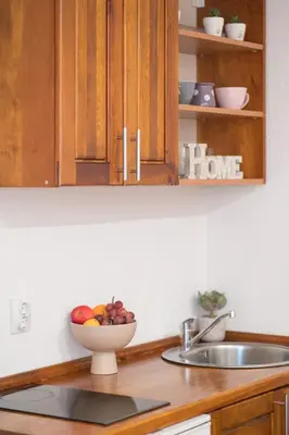 a bowl of fruit on a counter in a kitchen at Little Bay Apartments in Kotor