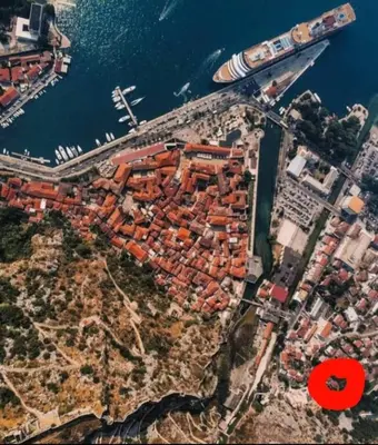 an aerial view of a city next to the water at Red House Apartment in Kotor