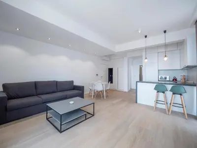 a living room with a couch and a table at Horizon-Two Bedroom Apartment Partial Sea View Charlene in Becici