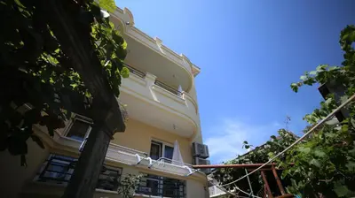 a building with a balcony and a blue sky at Davidoff Branko Kalezic in Budva
