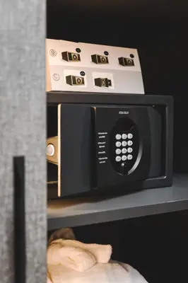 a microwave oven sitting on top of a shelf at SIGNUM Hotel in Podgorica