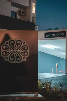 a collage of photos of a building with a sign at SIGNUM Hotel in Podgorica