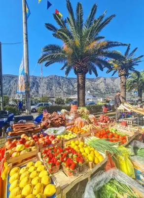 a display of fruits and vegetables at a market at Apartman J&I in Kotor