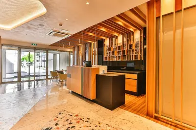 a room with a kitchen and a dining room at Carine Hotel Centar in Podgorica