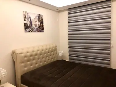 a bedroom with a bed and a large window at M & A Apartment Bar A 29 in Bar