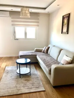 a living room with a couch and a table at M & A Apartment Bar A 29 in Bar