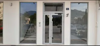 a glass door of a building with a view of a street at M & A Apartment Bar A 29 in Bar