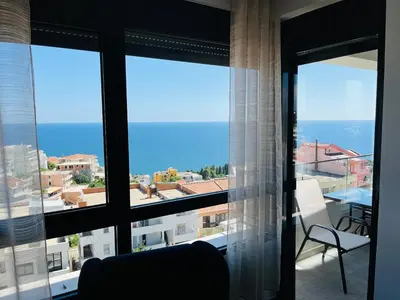 a view of the ocean from a room with windows at Art's Apartment mit Pool Ulcinj Pinjes in Ulcinj