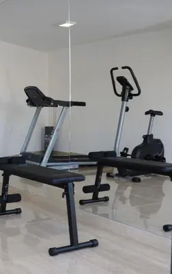 a group of exercise bikes in a gym at Art's Apartment mit Pool Ulcinj Pinjes in Ulcinj