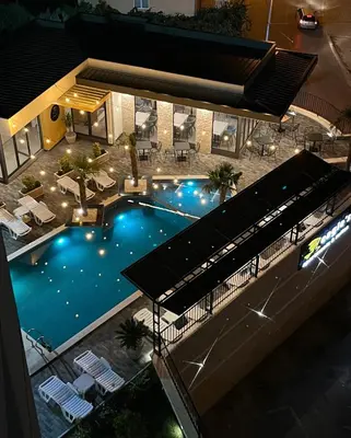 an overhead view of a swimming pool at night at Art's Apartment mit Pool Ulcinj Pinjes in Ulcinj