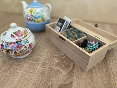 a table with a tea pot and a box of matches at Apartman Bojanic in Podgorica