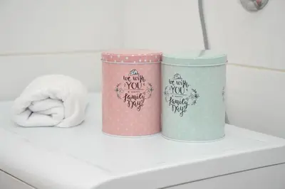 two cups sitting on top of a shelf in a bathroom at Apartman Bojanic in Podgorica