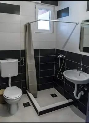 a bathroom with a toilet and a sink at Apartmani Maša in Budva