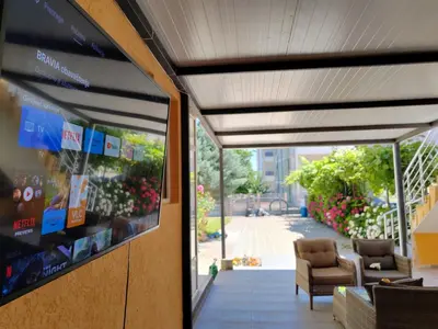 a building with a window with a view of a patio at Mali Medved Ulcinj in Ulcinj