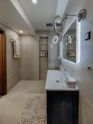 a bathroom with a sink and a shower at The Luxury Maison W Nest - 2 bedroom apartment in Kotor