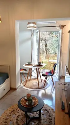 a living room with a table and two chairs at Bonaca Apartments in Budva