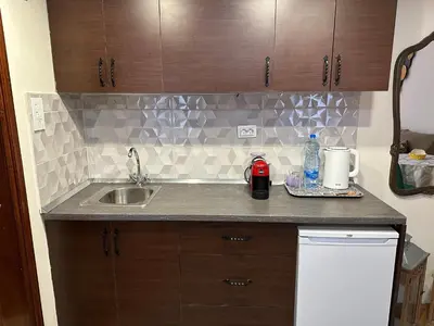 a kitchen with a sink and a counter top at Beatrix Suites in Budva