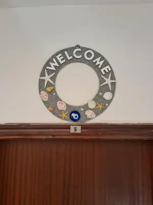 a wreath sitting on top of a wooden door at Beatrix Suites in Budva