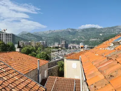 a view of the city from the roofs of buildings at Beatrix Suites in Budva