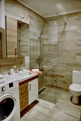a bathroom with a shower and a toilet and a sink at Sunset Apartments in Kotor