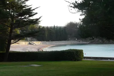 a view of a beach with a body of water at Guest house Živković in Sveti Stefan
