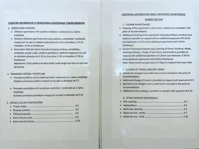 two white pages of a document with text at Fontana Residence Budva in Budva