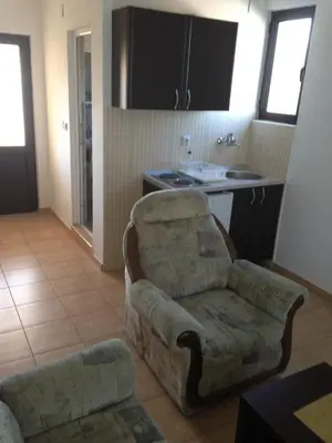 a living room with a couch and a chair at Niki Apartments in Ulcinj