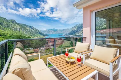 a balcony with a view of the mountains at Apartment Petar 2 in Kotor