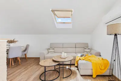 a living room with a couch and a table at Apartment Petar 2 in Kotor