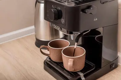 a coffee machine with two cups being brewed at Apartment Petar 2 in Kotor