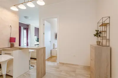 an office with a desk and a table in a room at Tre Canne Red Bull in Budva