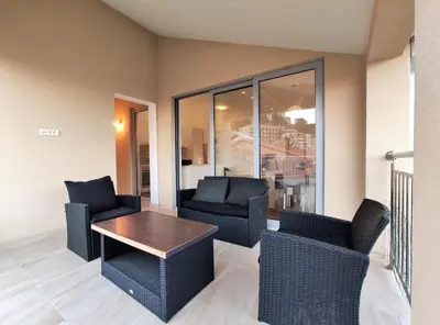 a living room with two chairs and a table at Pavlina Apartments Budva in Budva