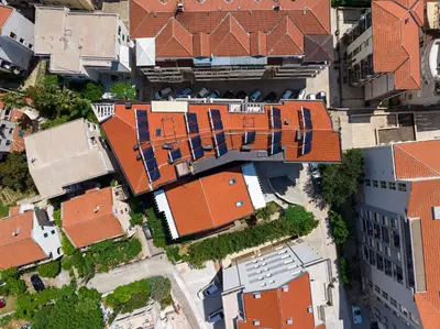 an overhead view of a group of red brick buildings at Marea Apartments Budva in Budva