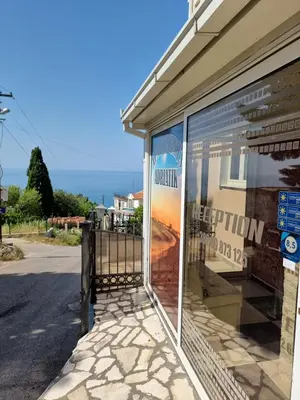a store window with a view of the ocean at Apartments Adriatik in Ulcinj