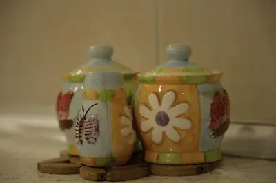 two vases sitting on top of a counter at Apartment Alexandra in Budva