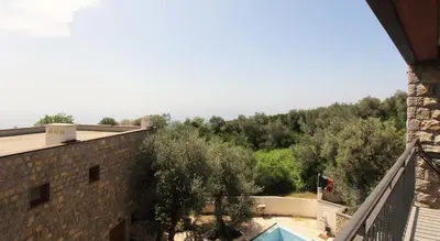 a view of the pool from the balcony of a building at Romantic sea view apartment in Petrovac in Petrovac na Moru