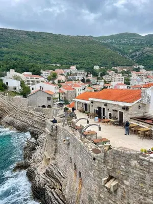 a view of a town next to the water at Romantic sea view apartment in Petrovac in Petrovac na Moru