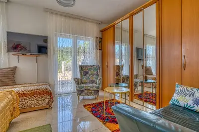 a living room with a bed and a couch at Adriatic paradise in Budva