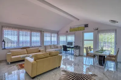 a living room with a couch and a table at Adriatic paradise in Budva