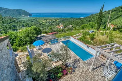 a villa with a pool and a view at Adriatic paradise in Budva