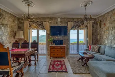 a living room with a couch and a table at Adriatic paradise in Budva