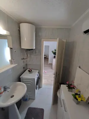 a bathroom with a sink and a toilet and a sink at Apartment Barba View in Kotor