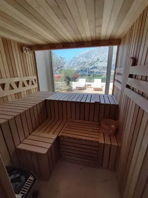 an empty sauna with a view of a mountain at Villa Vista Real in Kotor