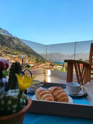 a tray of pastries on a table with a view at Villa Vista Real in Kotor