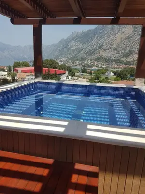 a swimming pool with a view of a mountain at Villa Vista Real in Kotor