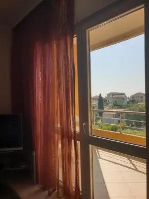 an open window with a view of a balcony at Apart hotel St.Pijerre in Stari Bar