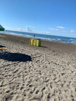 a beach with a couple of boxes on the sand at Apartman A2 in Ulcinj