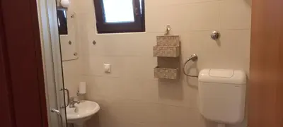 a bathroom with a toilet and a sink at Mila's studio in Kotor